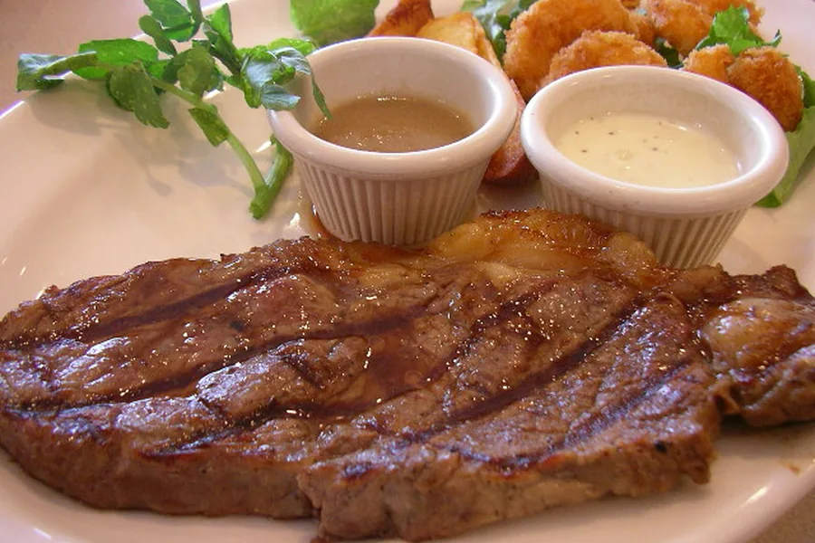 Steak and shrimp combination plate — representative food photograph